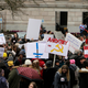 Opponents to efforts to remove philosophical exemptions from school-vaccine requirements rally outside the Washington Capitol, in Olympia, Wash., Wednesday, Feb. 20,2019.